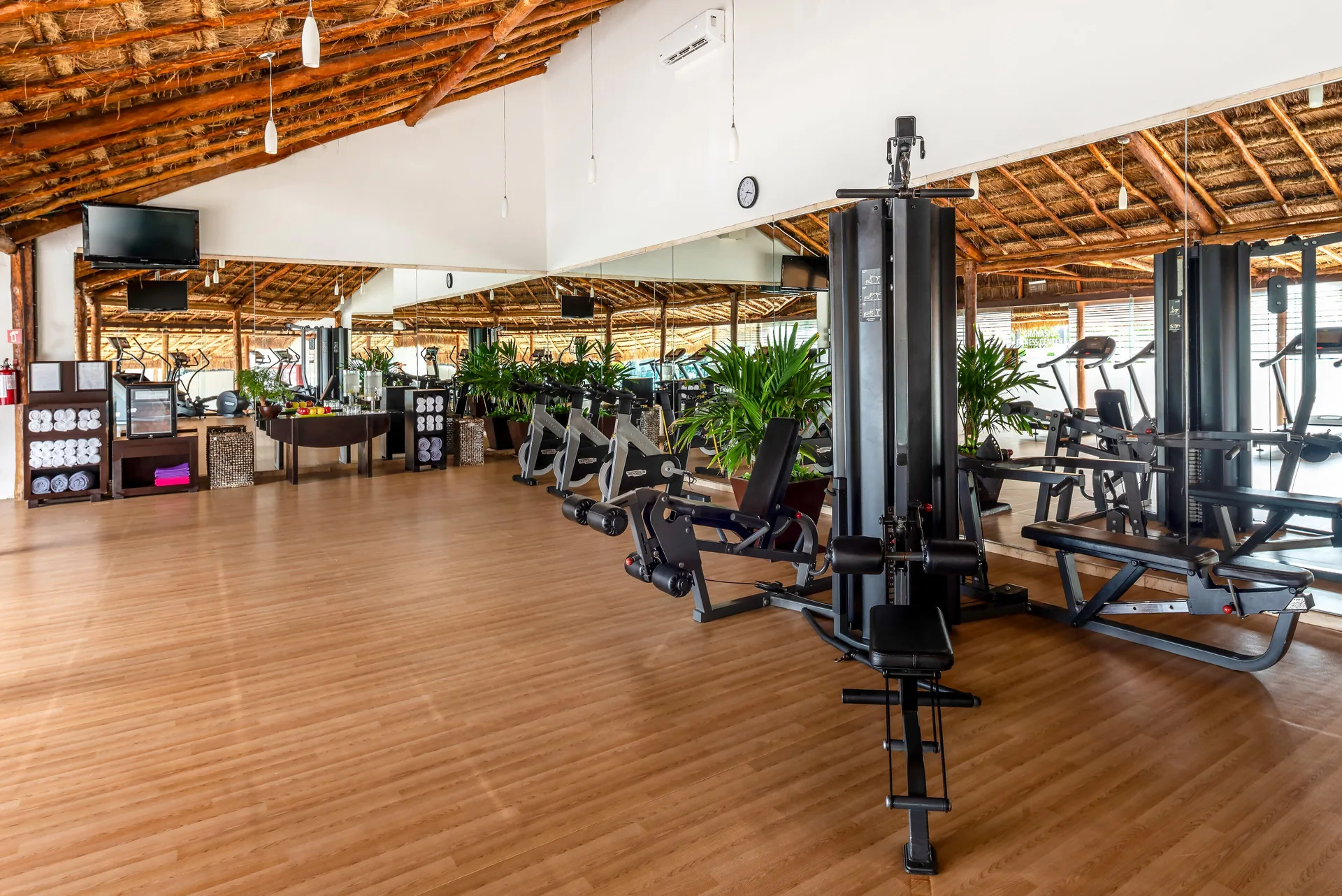 Fitness room with strength machines and mirrored walls at InterContinental Presidente Cancun Resort.