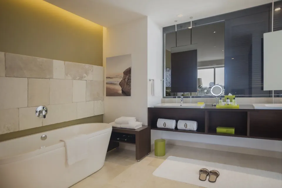 Guest bathroom with soaking tub and double vanity at InterContinental Presidente Cancun Resort.
