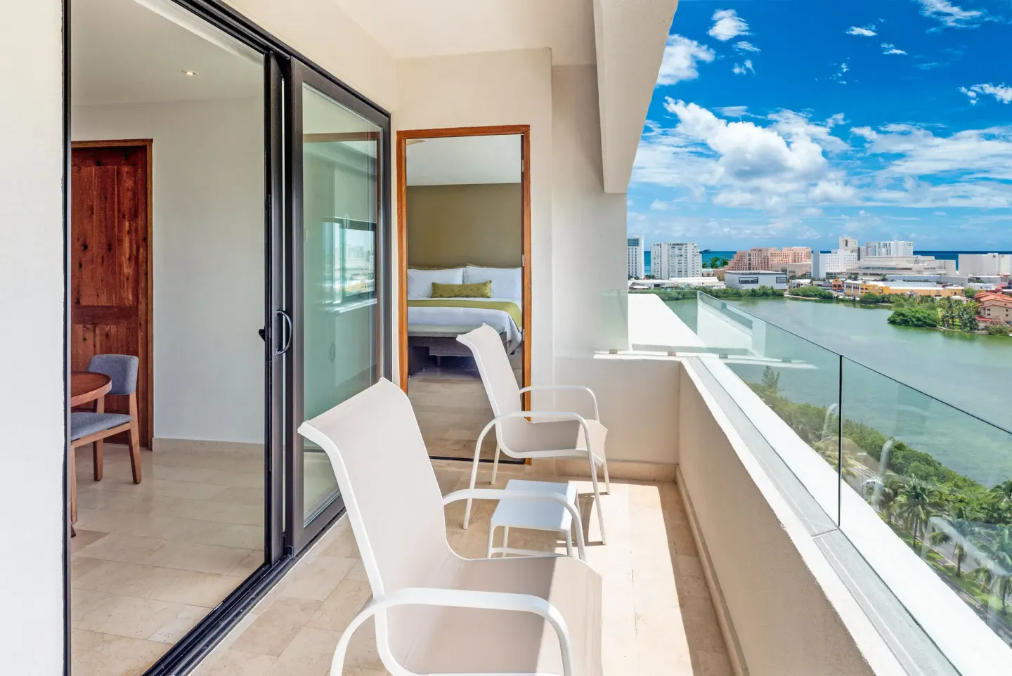Balcony with chairs and lagoon view at InterContinental Presidente Cancun Resort.