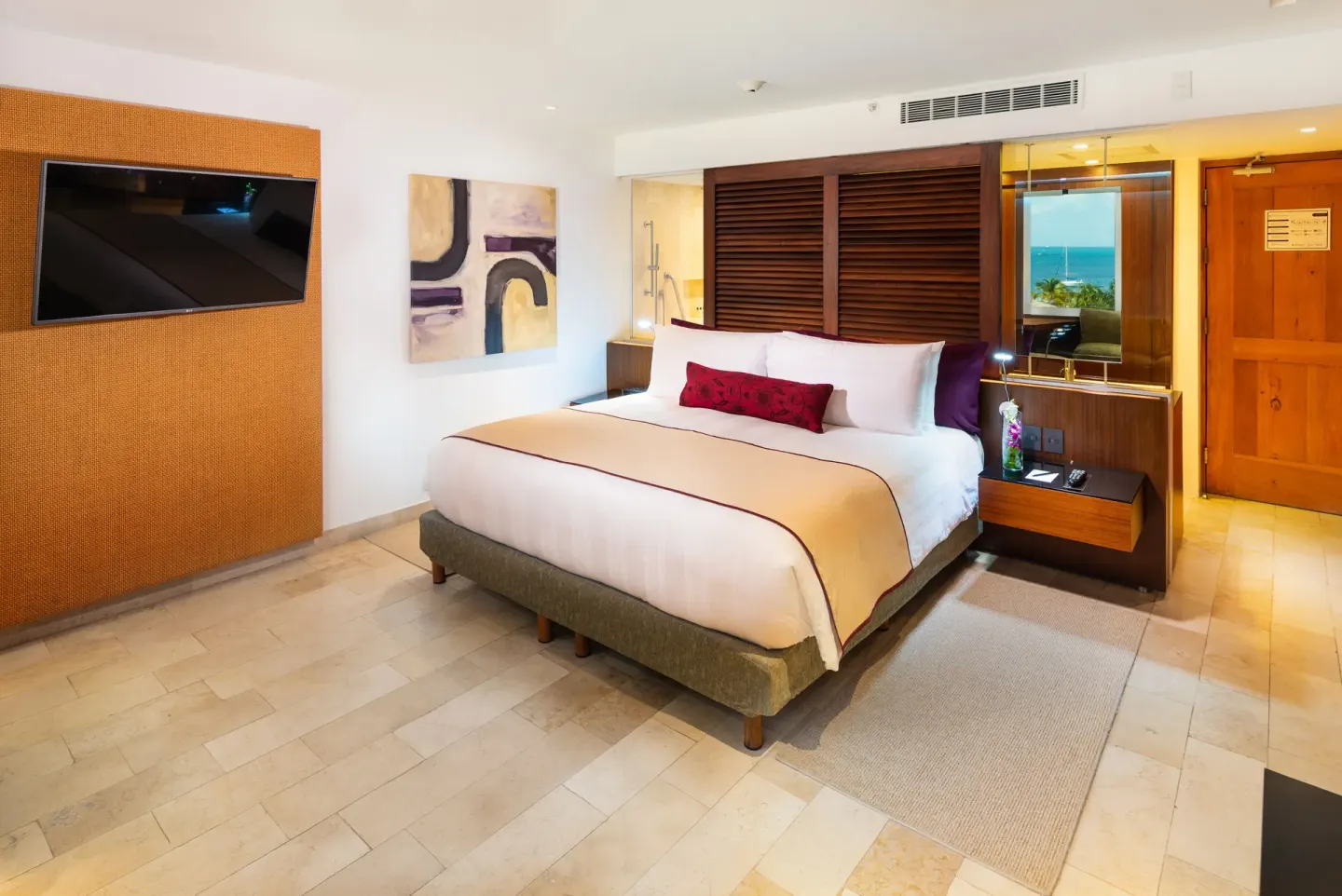 King guest room with wall-mounted TV at InterContinental Presidente Cancun Resort.