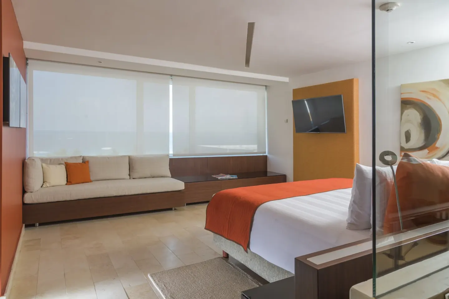 King guest room with sofa and filtered ocean view at InterContinental Presidente Cancun Resort.