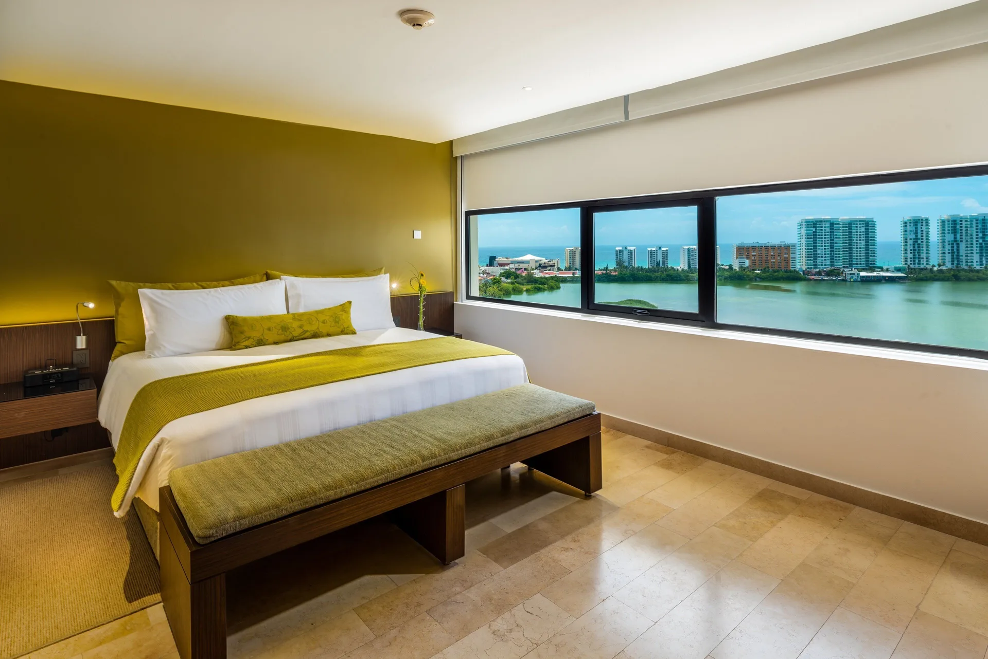 King bed guest room with lagoon view at InterContinental Presidente Cancun Resort.
