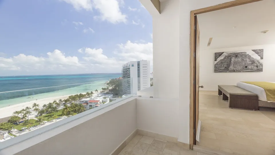 Balcony with beach and ocean view beside a guest room at InterContinental Presidente Cancun Resort.