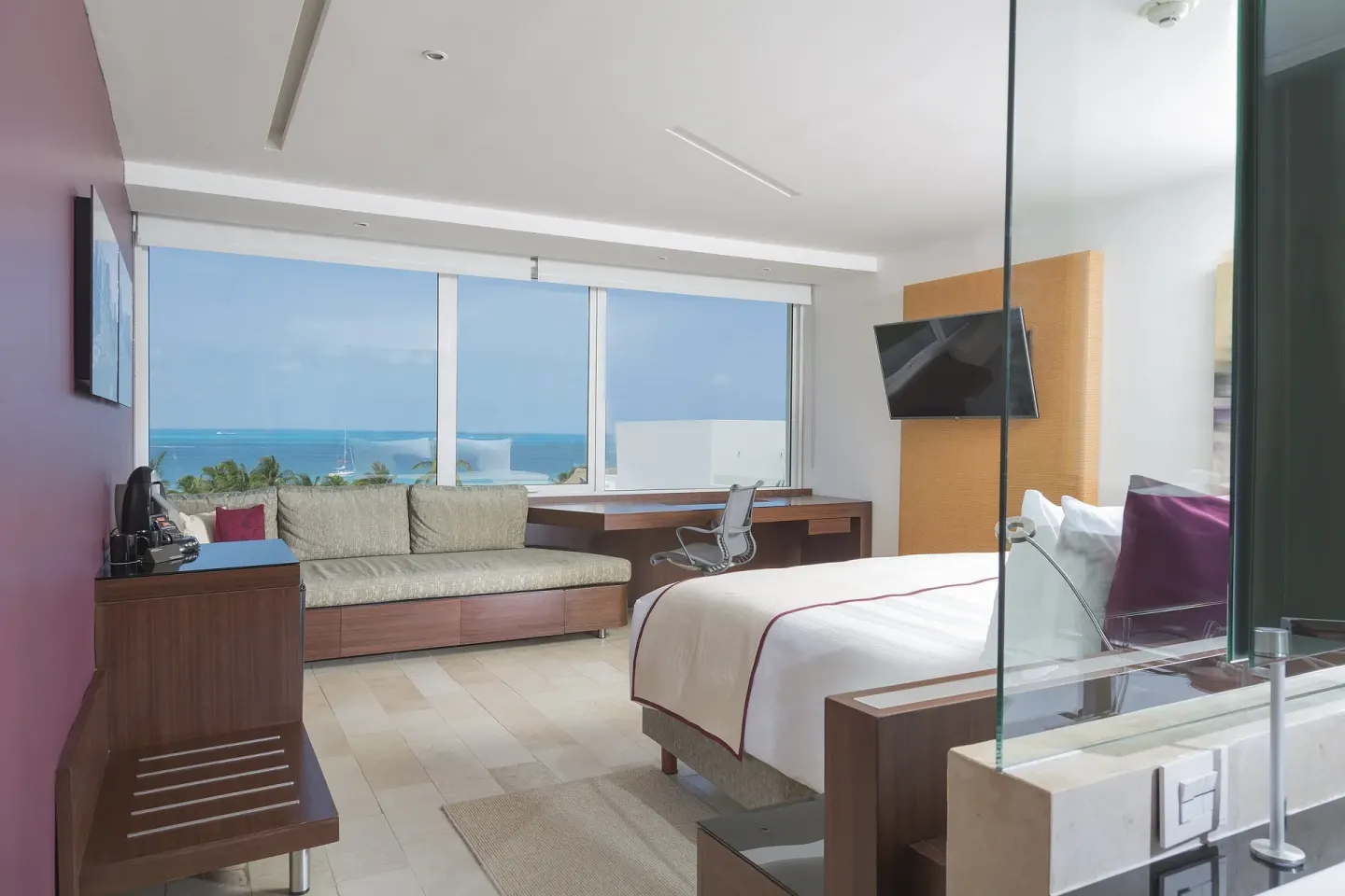 Ocean view king room with sofa and desk at InterContinental Presidente Cancun Resort.
