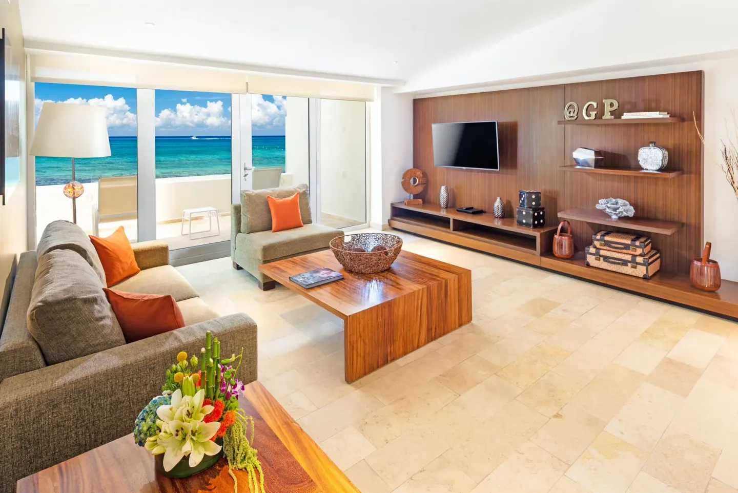 Oceanfront suite living room with balcony at InterContinental Presidente Cancun Resort.