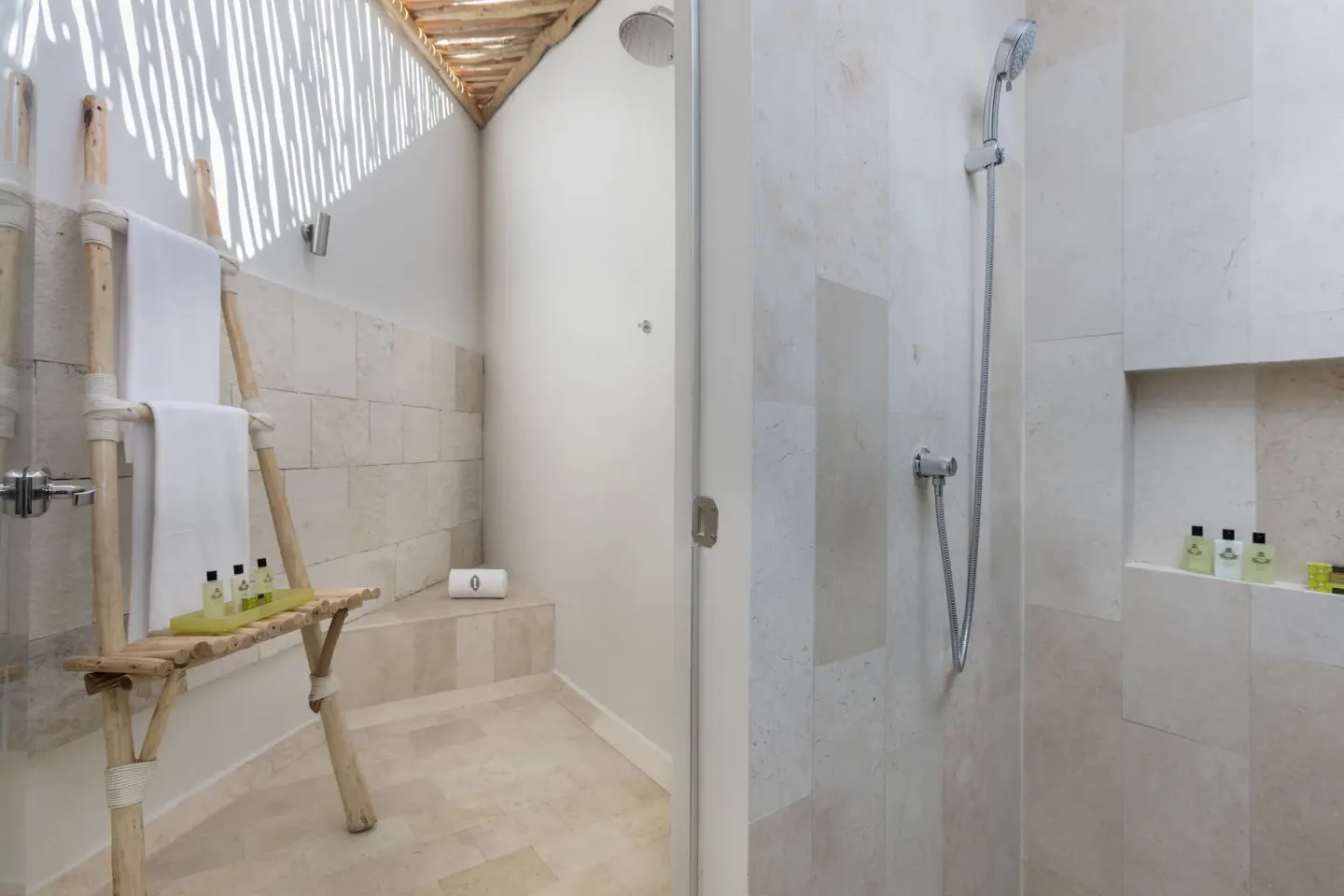 Outdoor-style shower area with towels at InterContinental Presidente Cancun Resort.