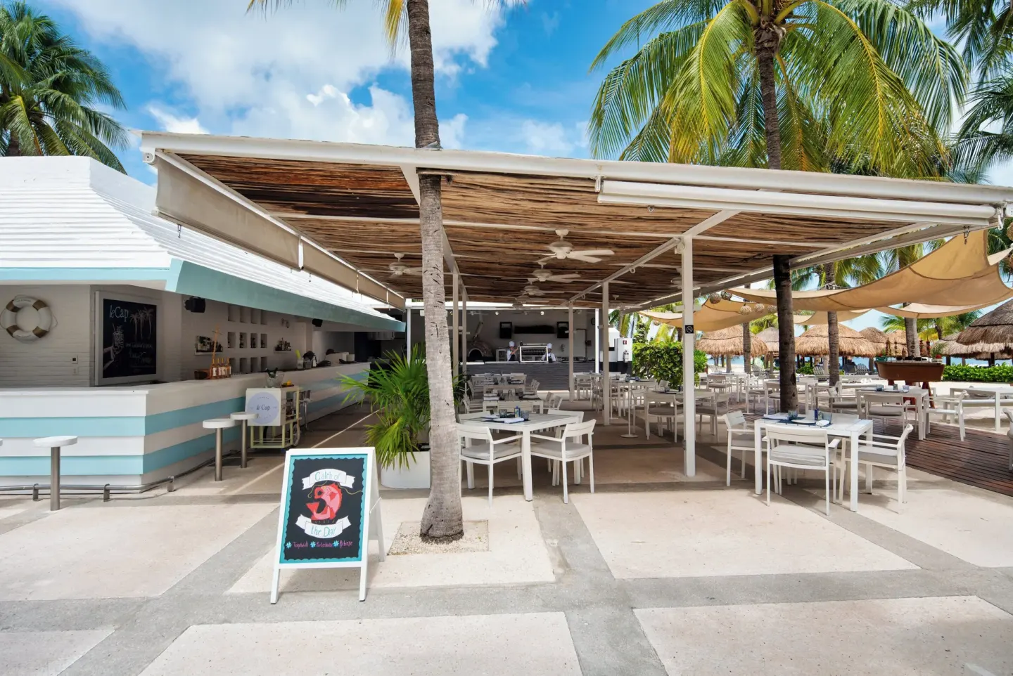 Beach club bar and terrace seating at InterContinental Presidente Cancun Resort.
