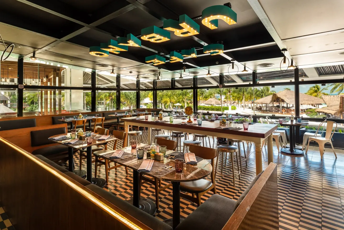 Interior dining room with tiled floor and outdoor views at InterContinental Presidente Cancun Resort.