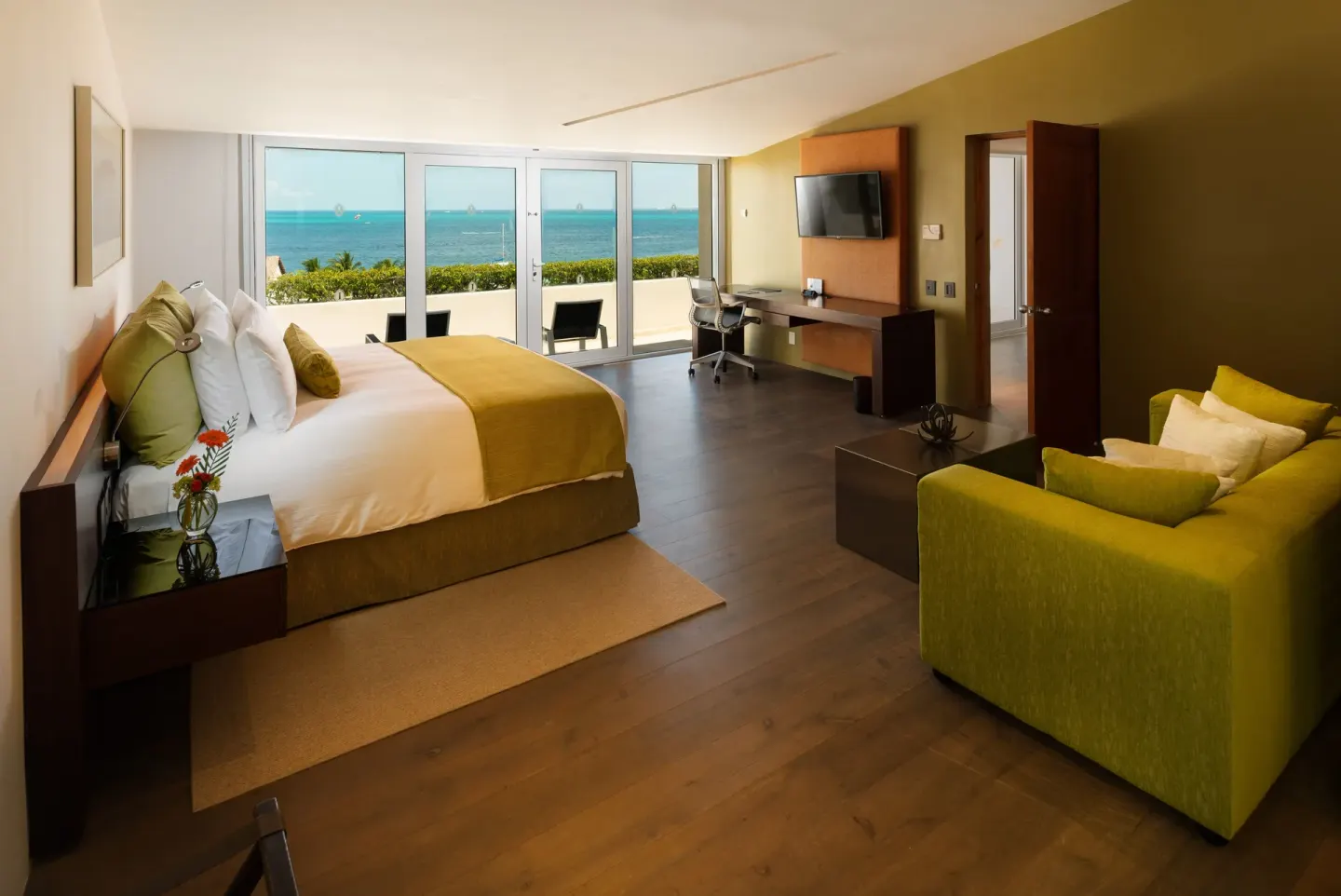 Coral Presidential Suite bedroom with king bed and oceanfront terrace at InterContinental Presidente Cancun Resort.