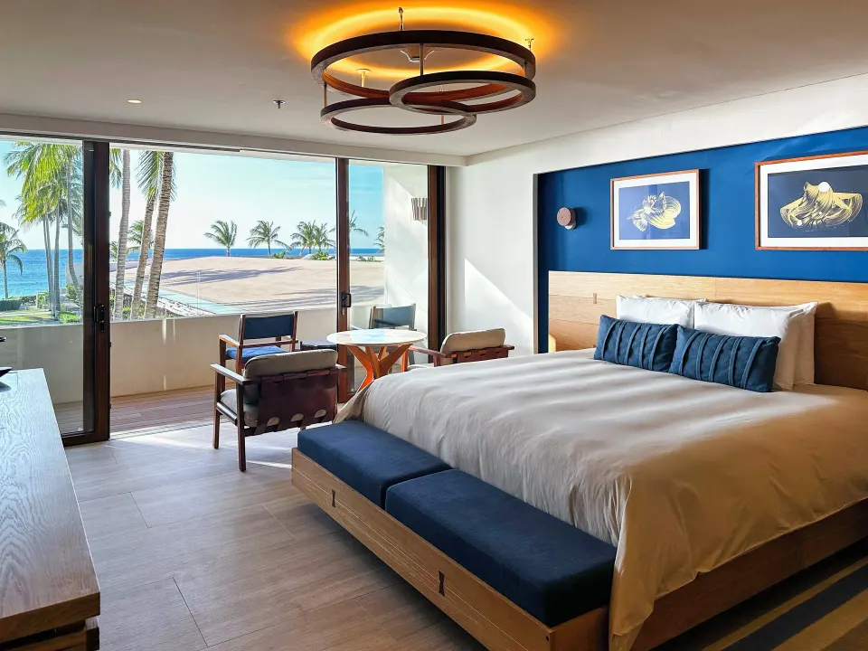 Junior suite with king bed and ocean-view doors at InterContinental Presidente Cozumel Resort Spa