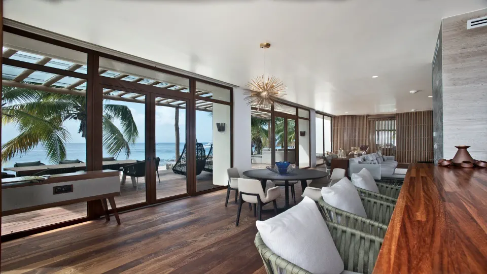 Open-plan lounge with floor-to-ceiling windows and ocean view at InterContinental Presidente Cozumel Resort Spa