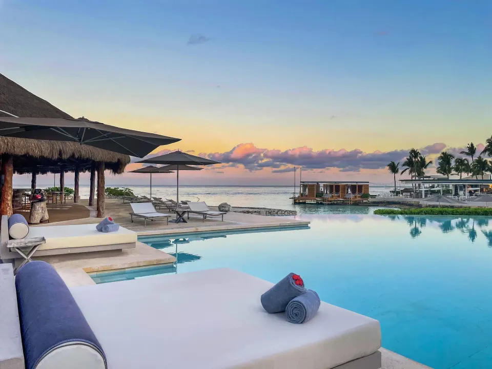 Poolside daybed and ocean sunset at InterContinental Presidente Cozumel Resort Spa