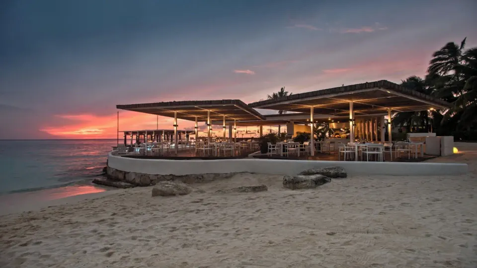 Open-air beachfront restaurant at sunset at InterContinental Presidente Cozumel Resort Spa