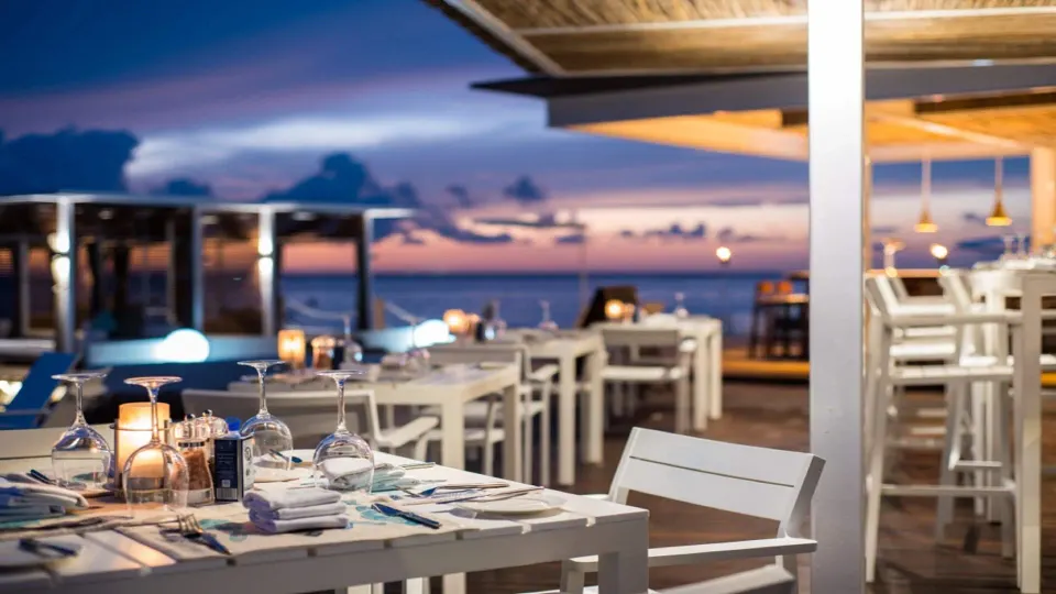 Table set for dinner on a beachfront deck at InterContinental Presidente Cozumel Resort Spa
