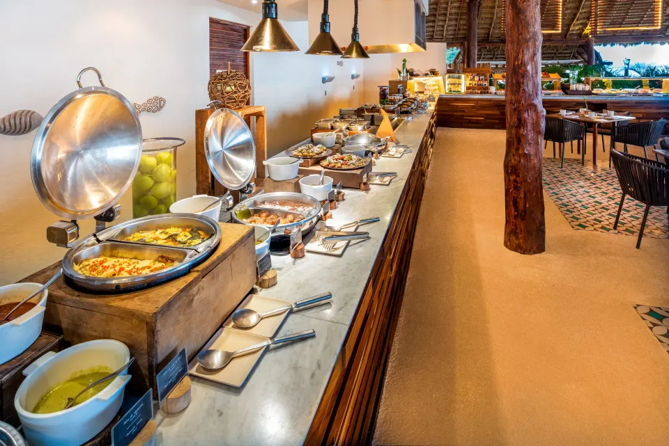 Hot buffet line with covered chafing dishes at InterContinental Presidente Cozumel Resort Spa