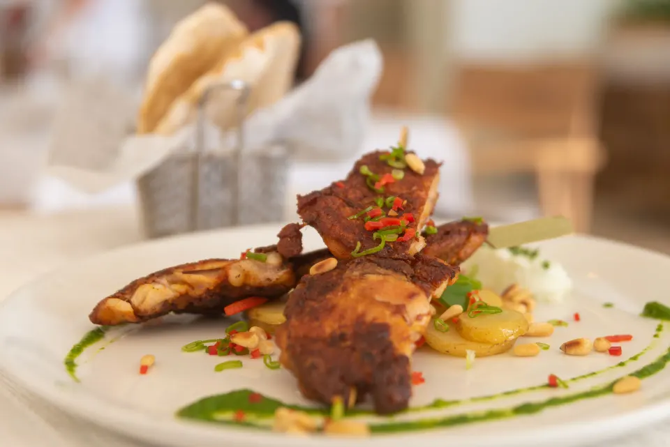 Close-up of plated seafood dish on white plate at InterContinental Presidente Cozumel Resort Spa