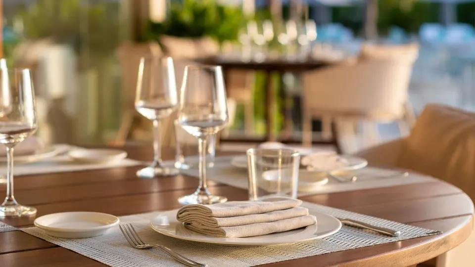 Close-up of a table setting with glassware and napkin at InterContinental Presidente Cozumel Resort Spa