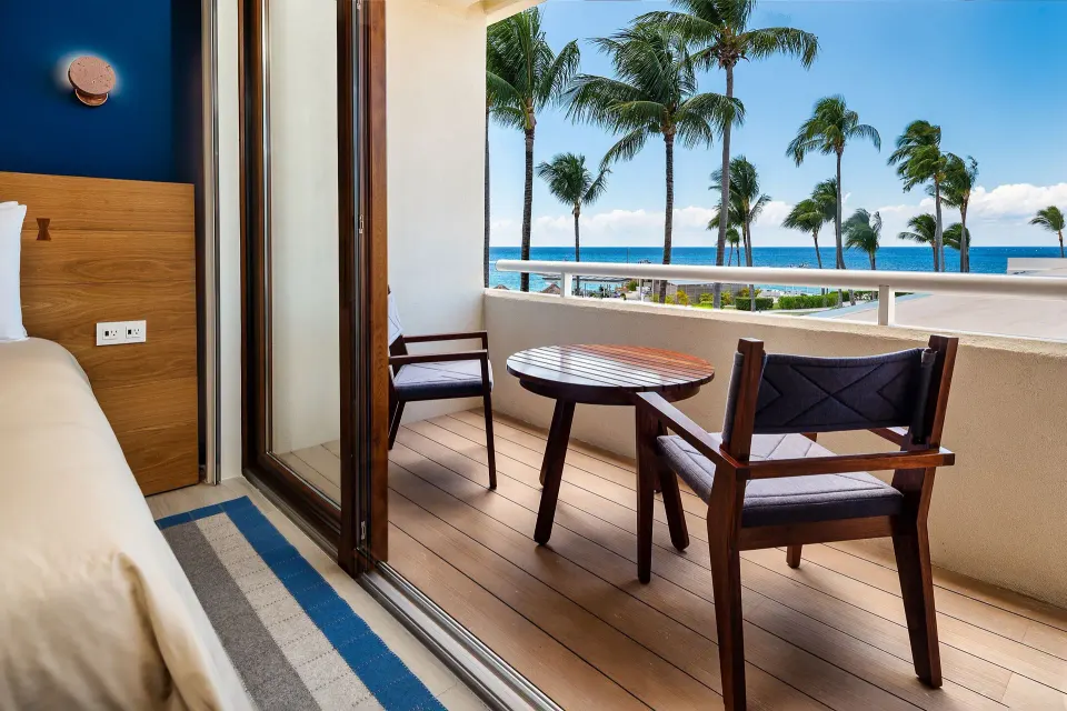 Balcony seating with ocean view from a Classic Room at InterContinental Presidente Cozumel Resort Spa