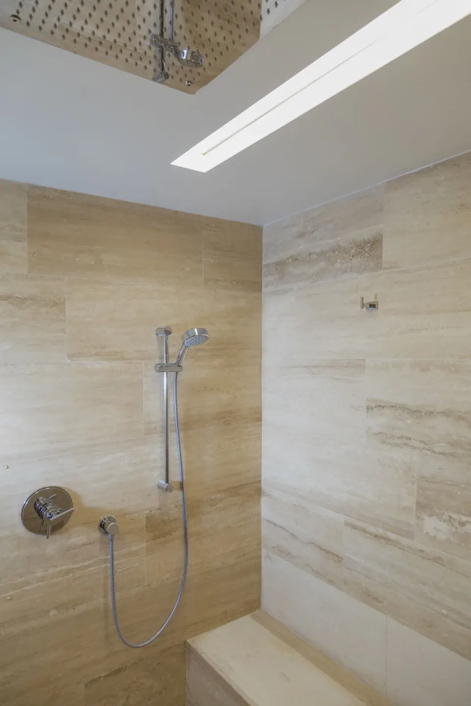 Tiled walk-in shower with rainfall head and handheld shower in a Classic Room at InterContinental Presidente Cozumel Resort S