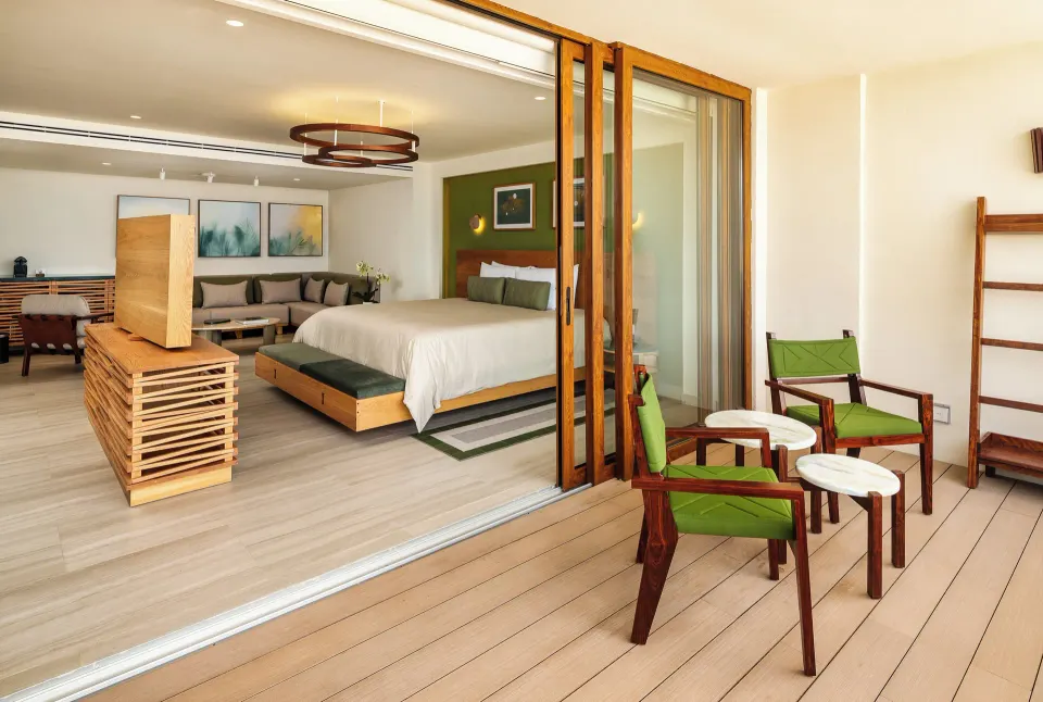 Junior Suite balcony and king bed with sliding doors at InterContinental Presidente Cozumel Resort Spa