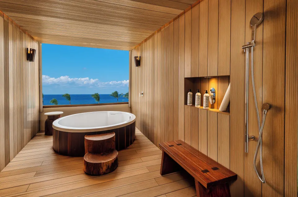 Spa room with wooden walls, round soaking tub and sea view at InterContinental Presidente Cozumel Resort Spa