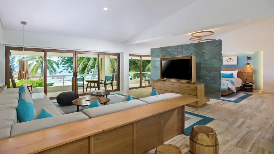 Spacious Junior Suite living area and king bed with ocean view at InterContinental Presidente Cozumel Resort Spa