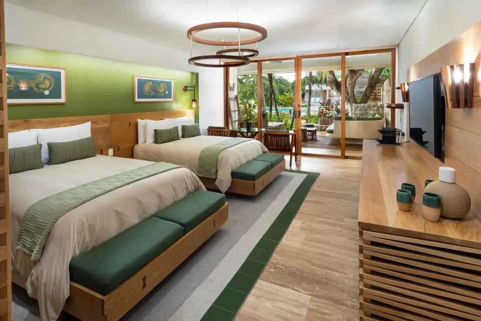 Two-bed Premium Room Pool Access looking toward patio and pool at InterContinental Presidente Cozumel Resort Spa