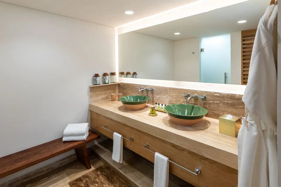 Bathroom vanity with double sinks and illuminated mirror at InterContinental Presidente Cozumel Resort Spa