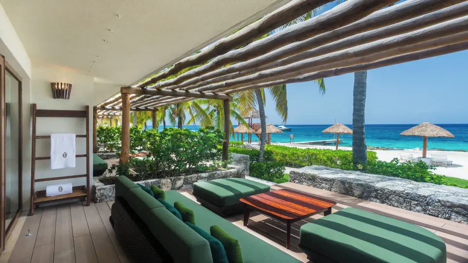 Private terrace with lounge seating and beach view at InterContinental Presidente Cozumel Resort Spa