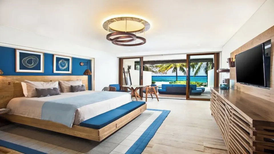 Seafront Premium Room king bed and open terrace with ocean view at InterContinental Presidente Cozumel Resort Spa