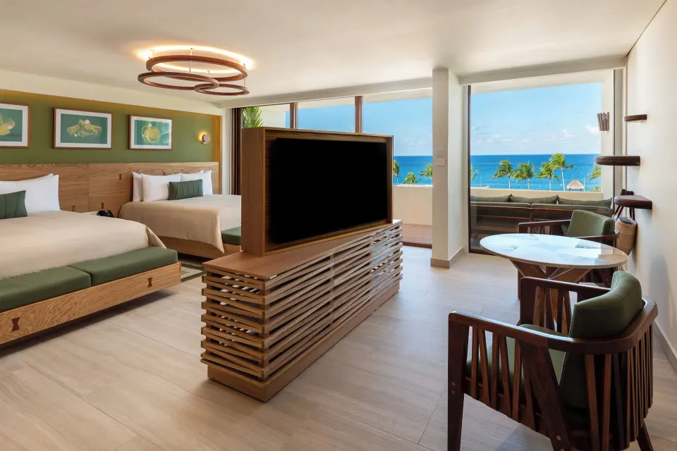 Wide-angle ocean-view suite with two beds and balcony at InterContinental Presidente Cozumel Resort Spa