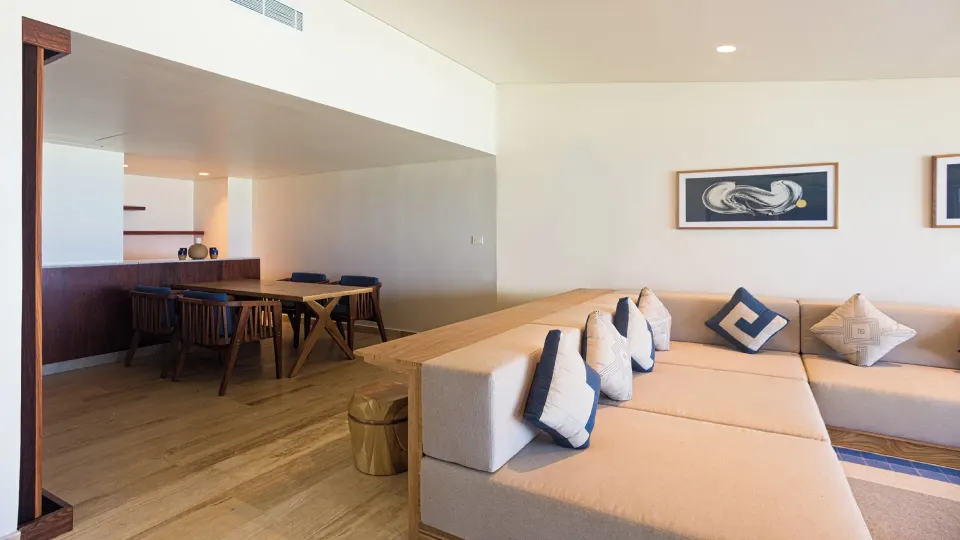 Living room area of a Reef Beach Access suite with sofa and sea view at InterContinental Presidente Cozumel Resort Spa