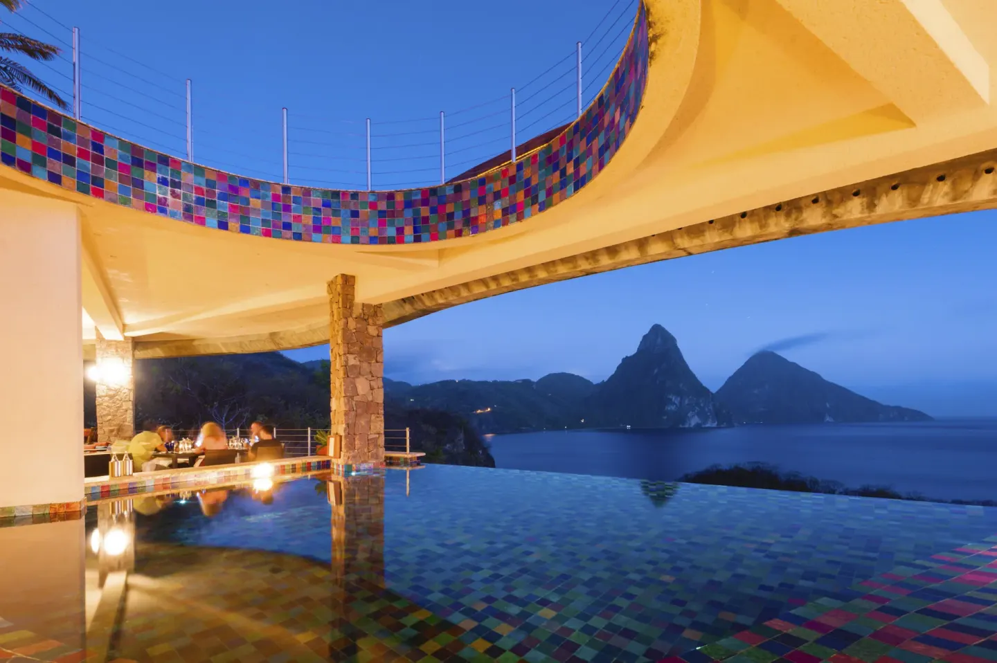 Infinity pool with colorful tile and Piton views at dusk at Jade Mountain Resort.