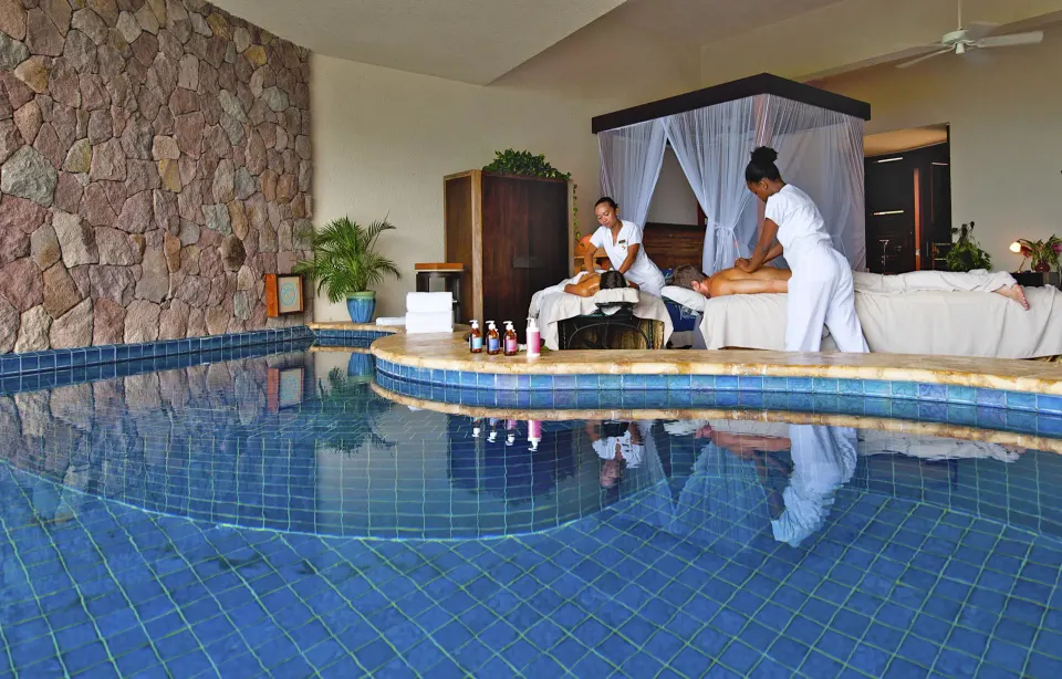 Moon Suite massage setup beside the pool and canopy bed at Jade Mountain Resort.