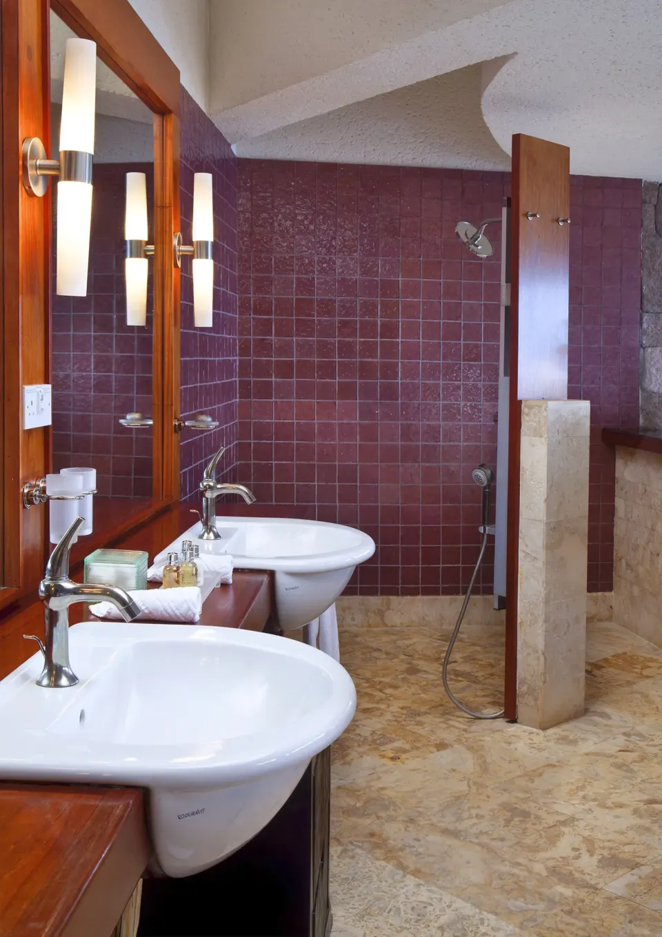 Sky Suite bathroom with twin sinks and open shower at Jade Mountain Resort.