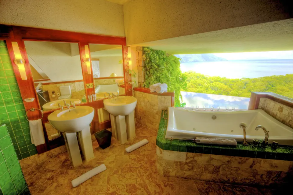 Star suite bathroom with twin sinks and soaking tub at Jade Mountain Resort.