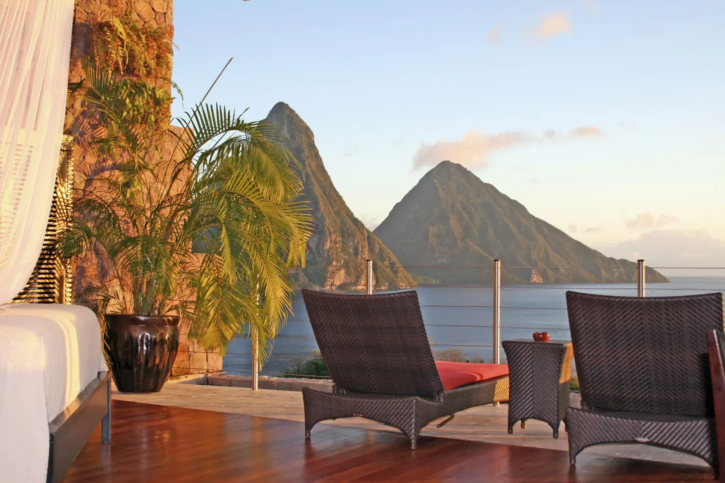 Sun suite terrace with bed, loungers and Piton views at Jade Mountain Resort.