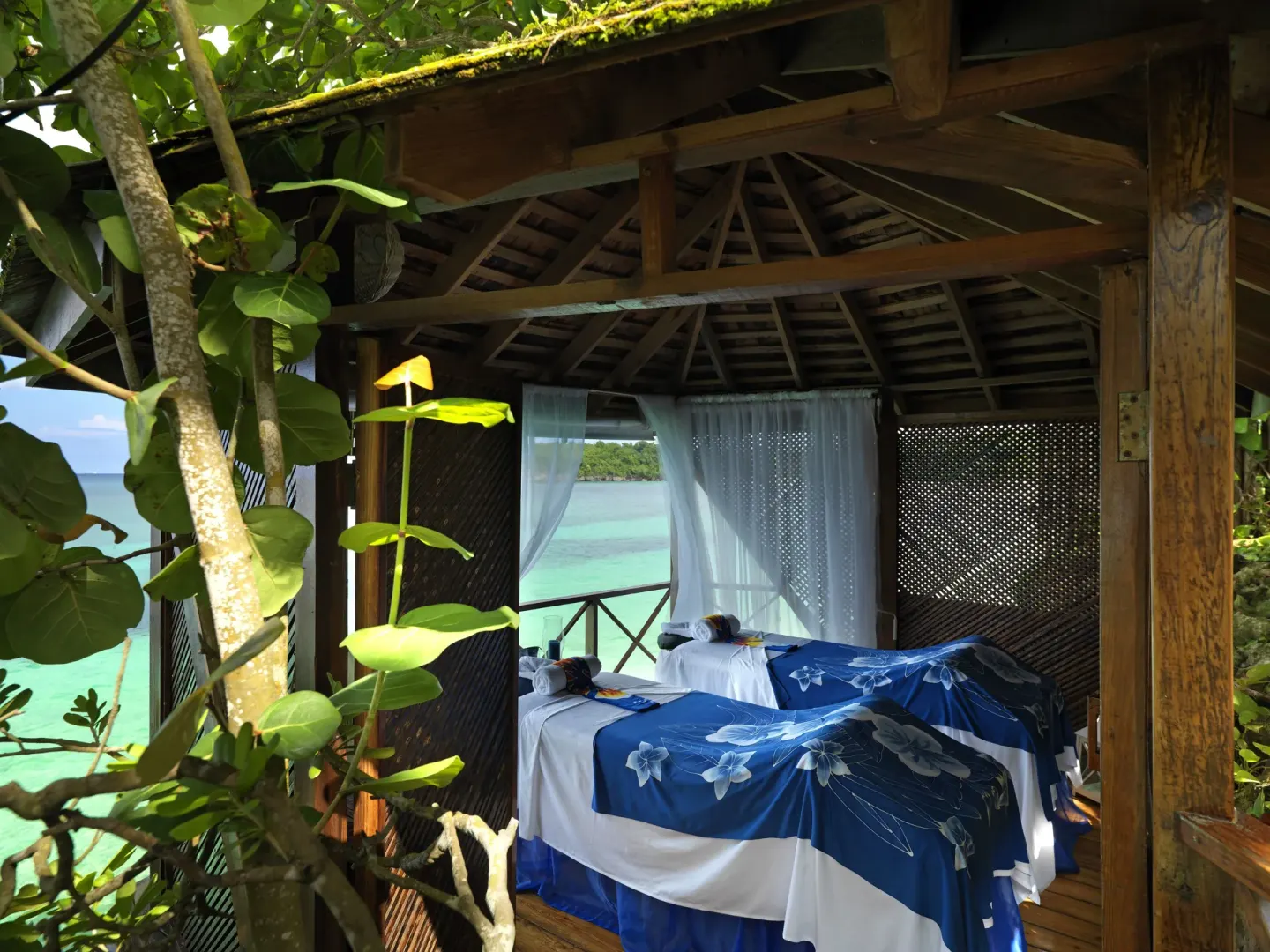 Open-air spa pavilion with two treatment beds at Jamaica Inn.