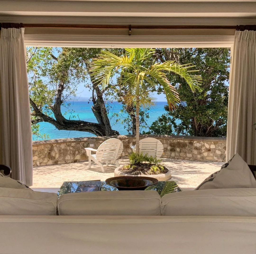 Cottage Four sitting area opens to a terrace and sea view at Jamaica Inn.