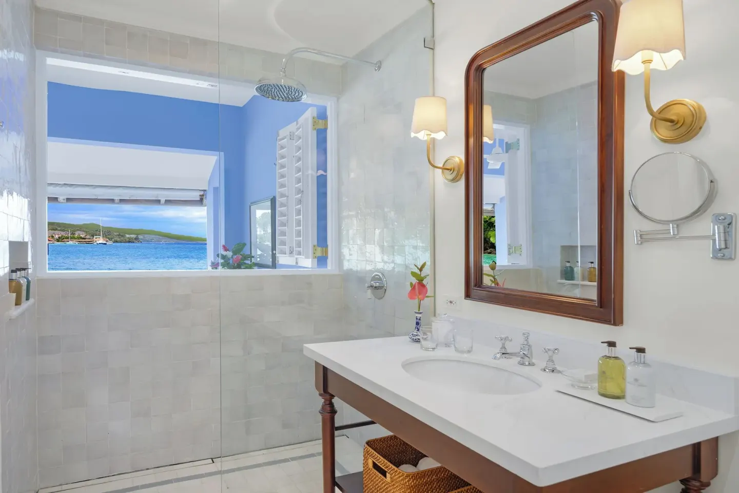 Premier Suite bathroom vanity and shower with sea view at Jamaica Inn.