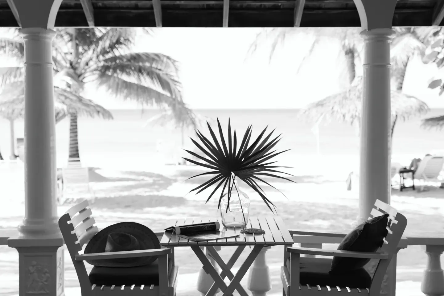 Premier Suite verandah table and chairs overlooking the beach at Jamaica Inn.