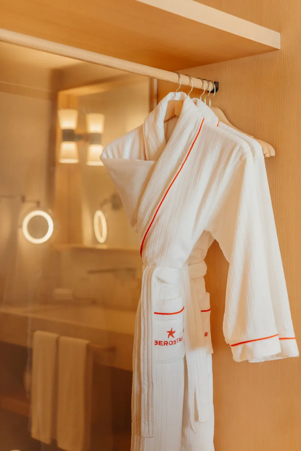 White robe hanging in the Suite Pool View closet at JOIA Aruba.