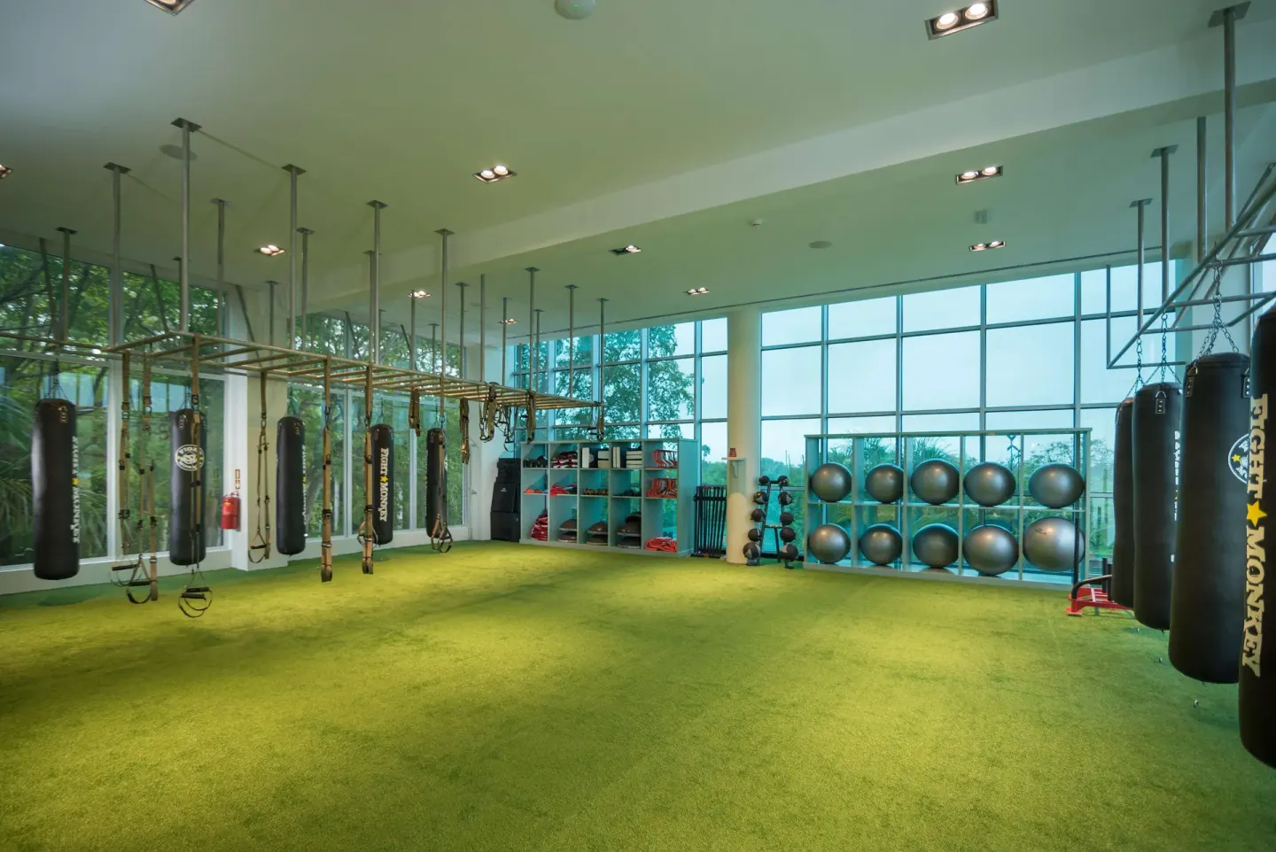 Training room with punching bags and exercise equipment at JOIA Bávaro by Iberostar.