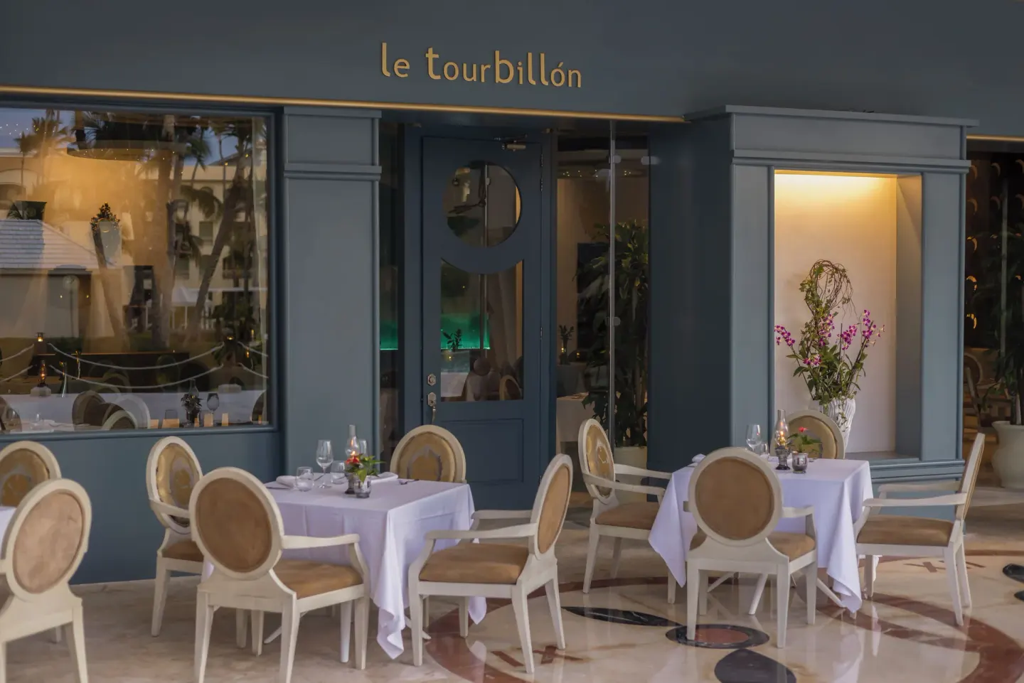 Le Tourbillon entrance with outdoor tables at JOIA Bávaro by Iberostar.