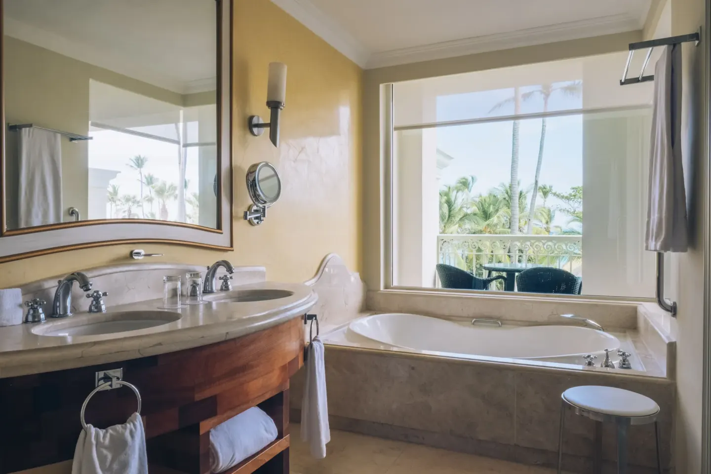 Suite Lake View bathroom with tub and double vanity at JOIA Bávaro by Iberostar.