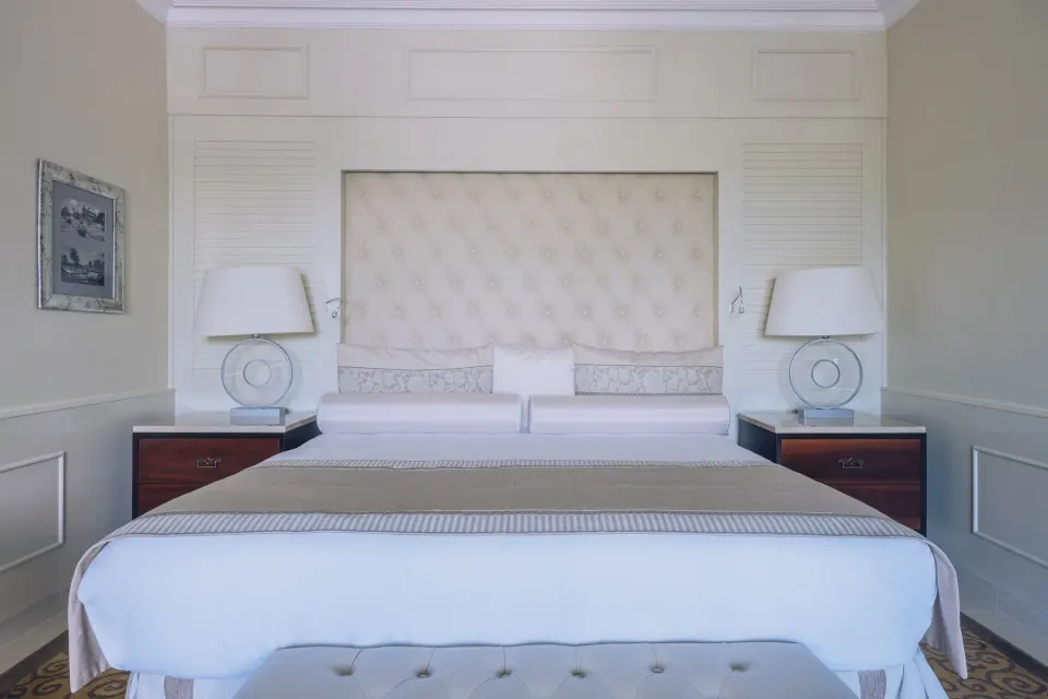 Suite Lake View bedroom with king bed at JOIA Bávaro by Iberostar.