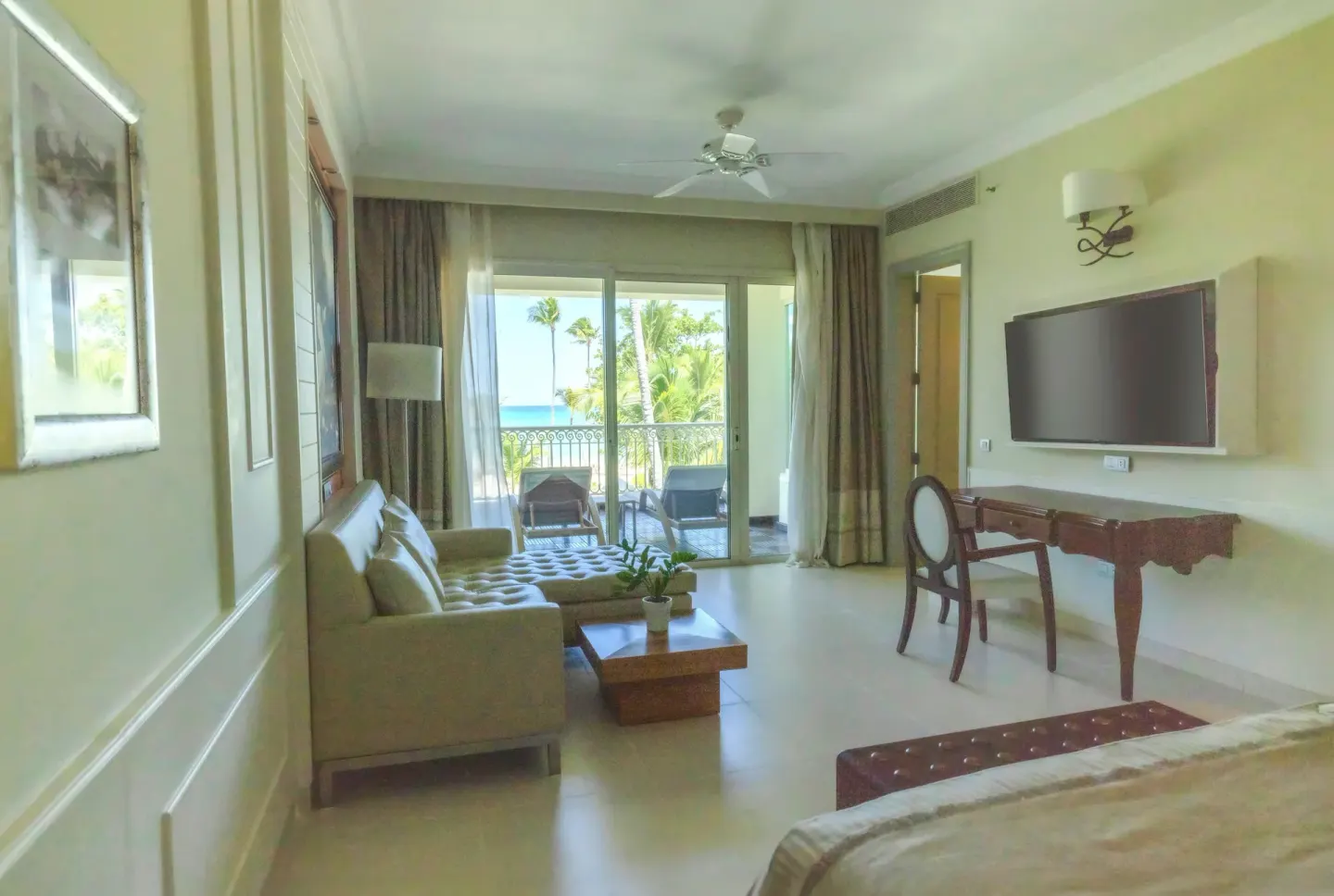 Oceanfront suite seating area with balcony view at JOIA Bávaro by Iberostar.