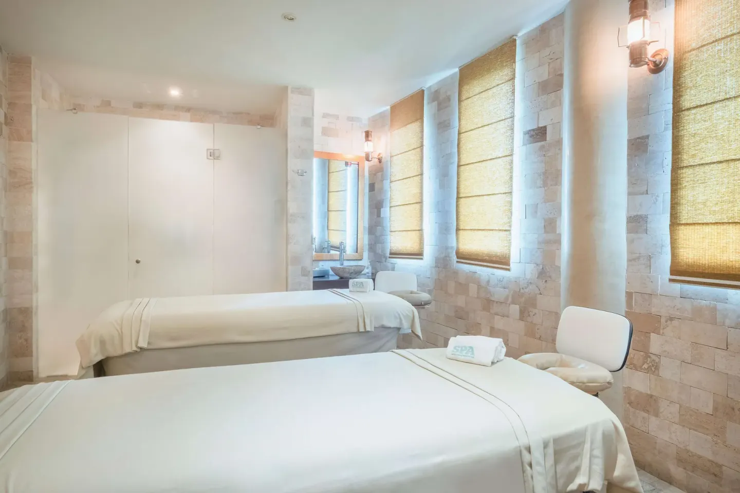 Spa treatment room with two massage tables at JOIA Paraíso by Iberostar.