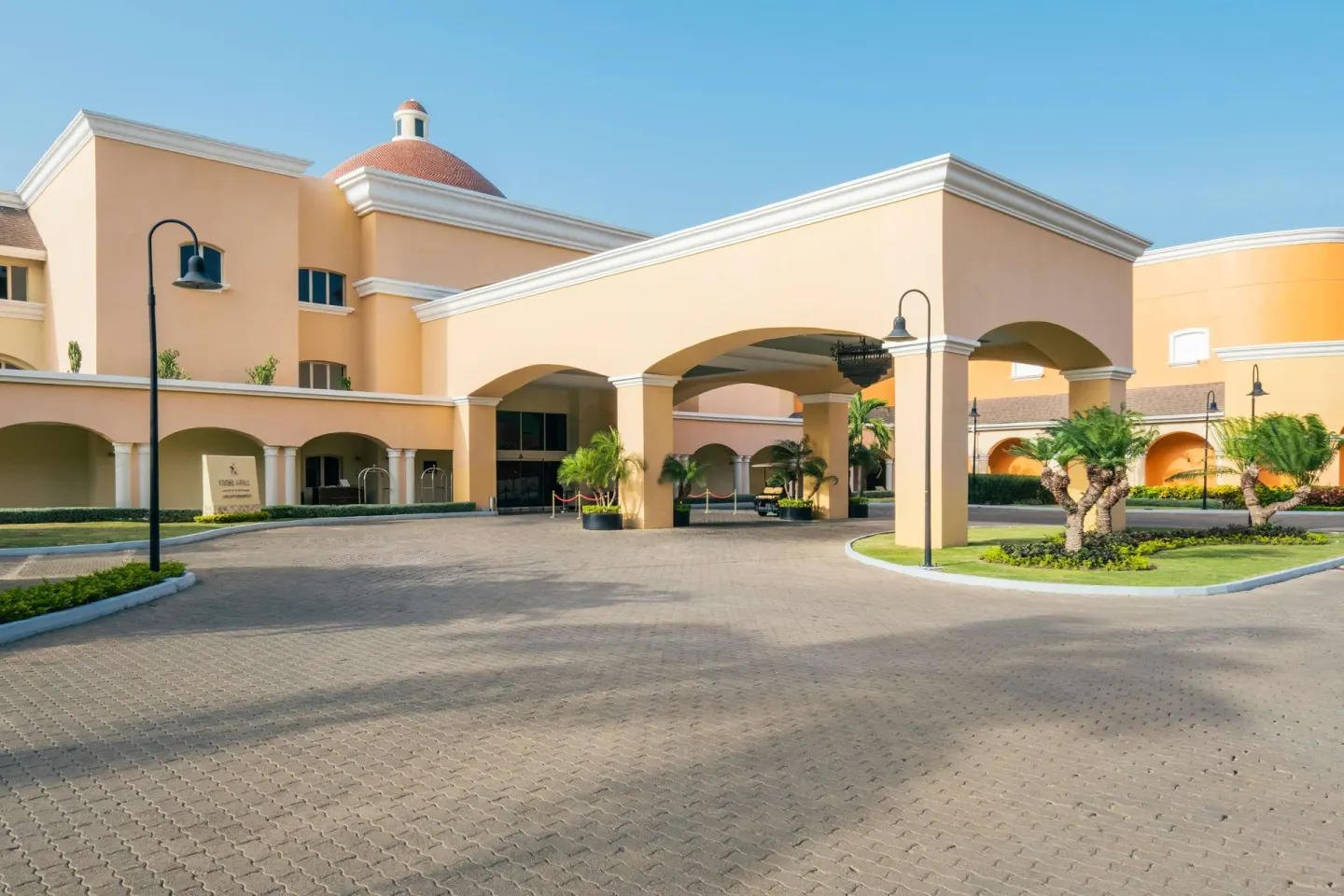 Covered resort entrance and driveway at JOIA Rose Hall by Iberostar.