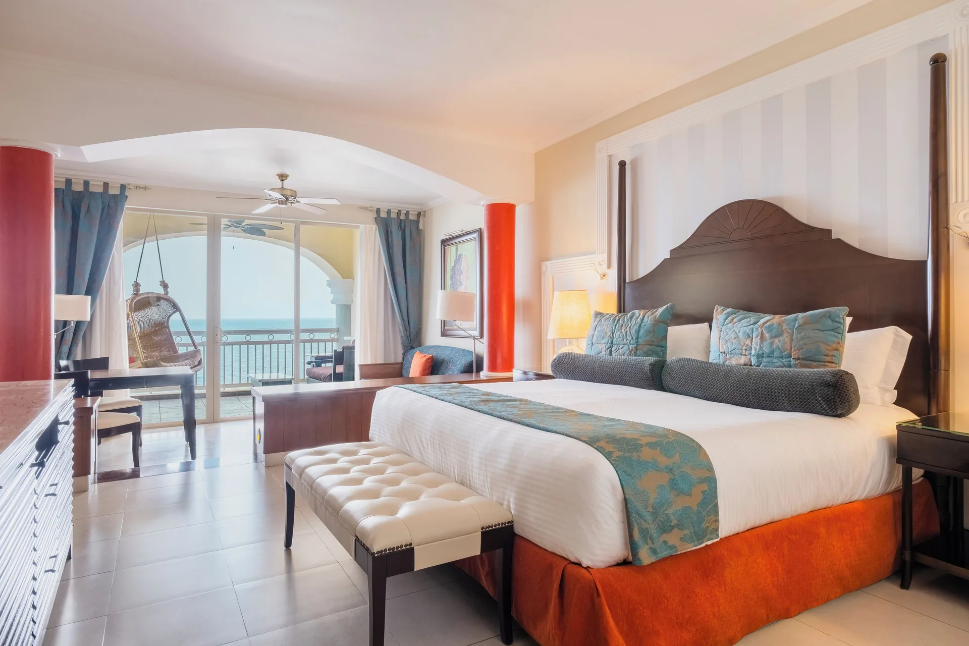 Ocean-view guest room at JOIA Rose Hall by Iberostar with king bed and balcony beyond.